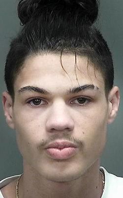 Man robbed at gunpoint in Janesville, 1 suspect arrested, another at large